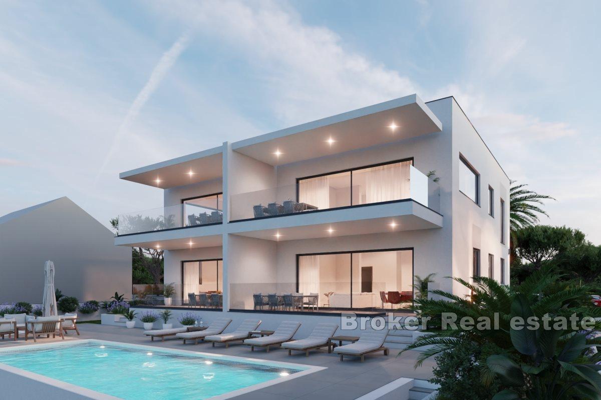 Modern apartments in a new building with a pool and a view