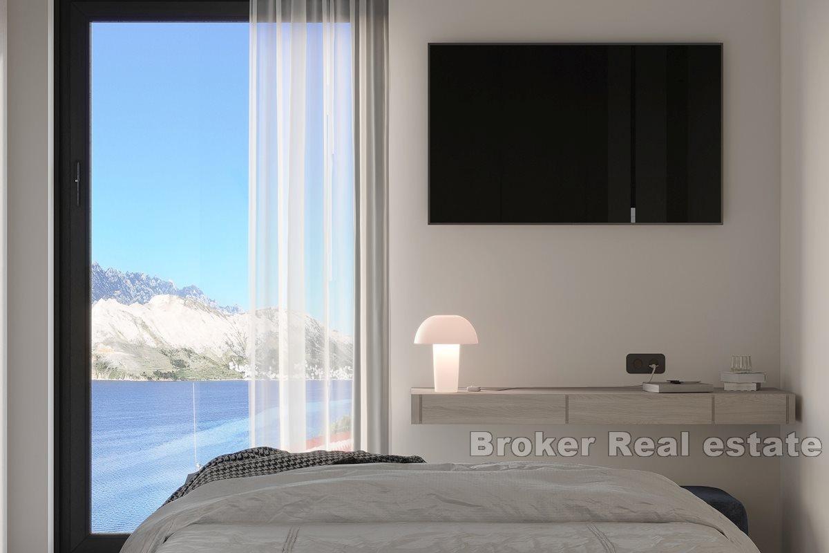 Modern apartments in a new building with a pool and a view