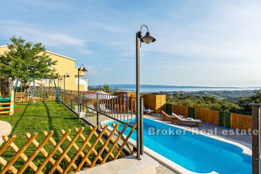 Split area, villa with pool and open view