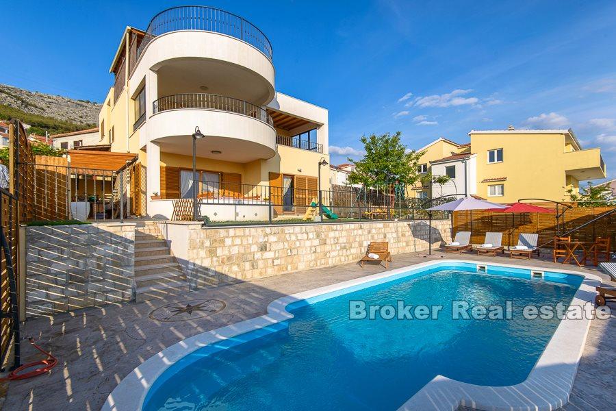 Split area, villa with pool and open view