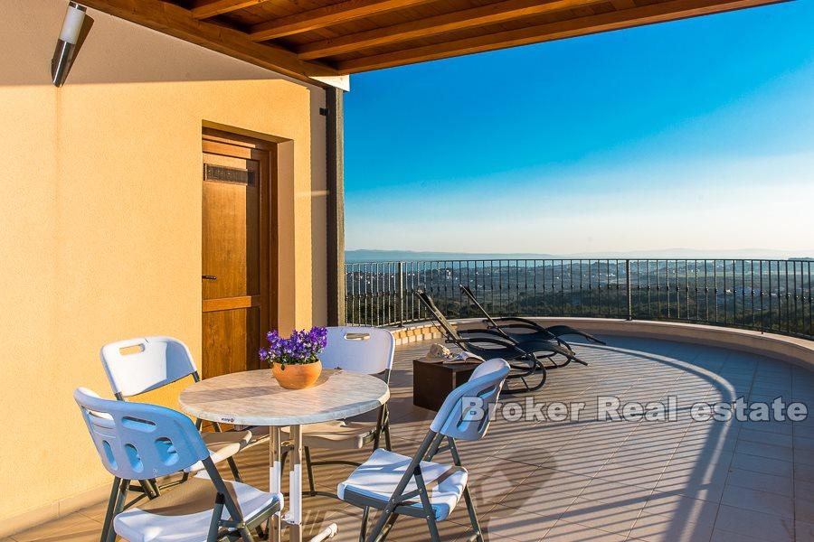 Split area, villa with pool and open view