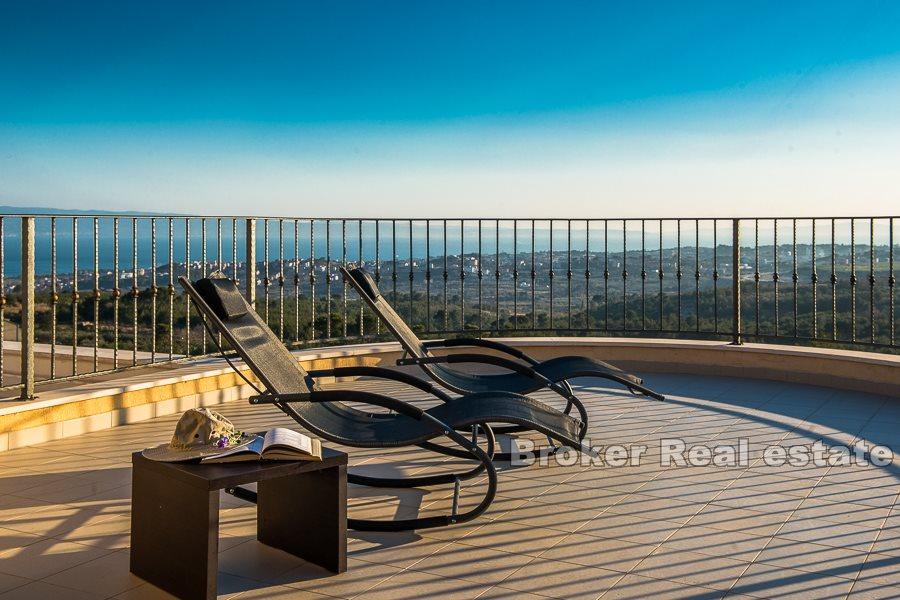 Split area, villa with pool and open view