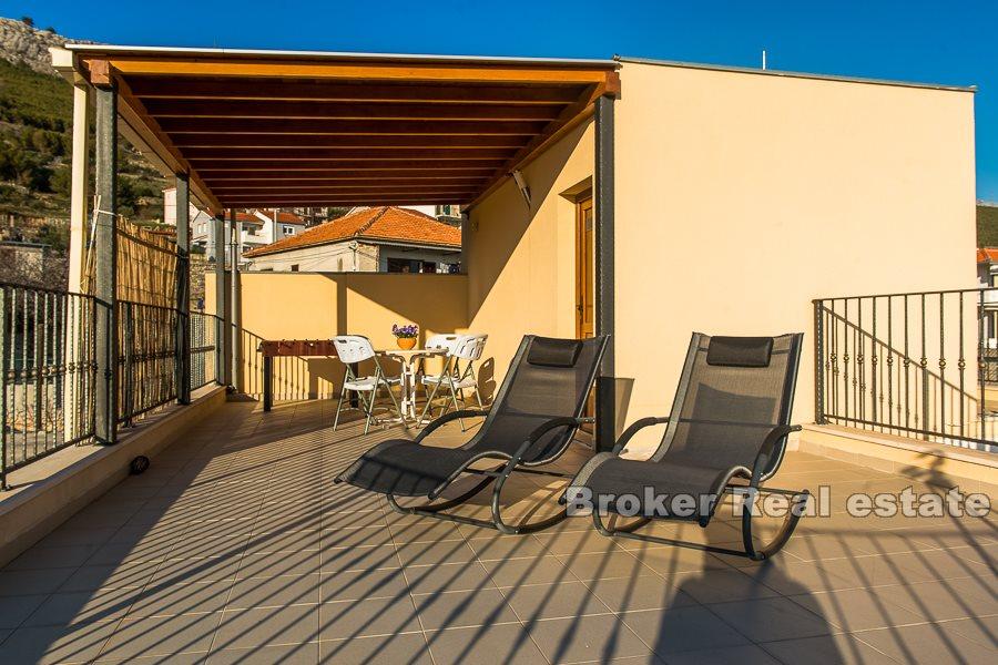 Split area, villa with pool and open view