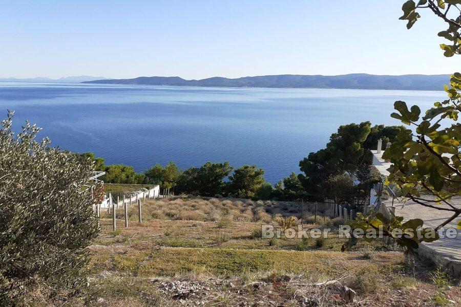 Near Omis, building land first row to the sea
