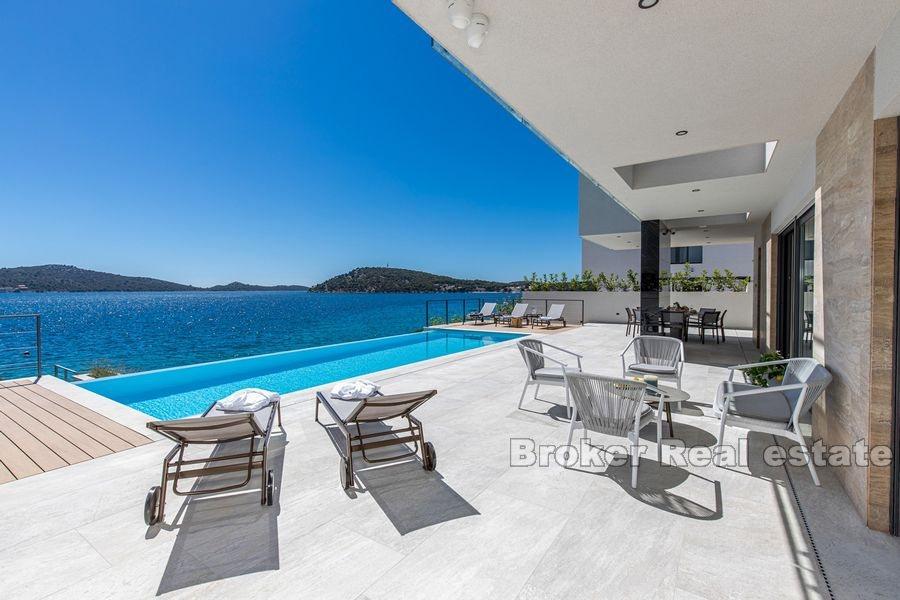 Near Rogoznica, newly built modern villa with pool, first row to the sea