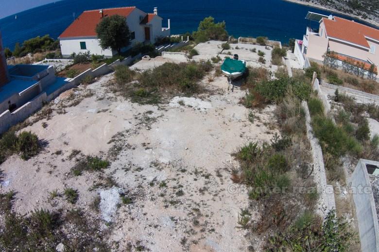 Area of Rogoznica, building land plot at first row to the sea