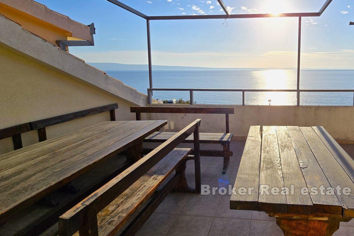 Apartment house with office space, first row to the sea