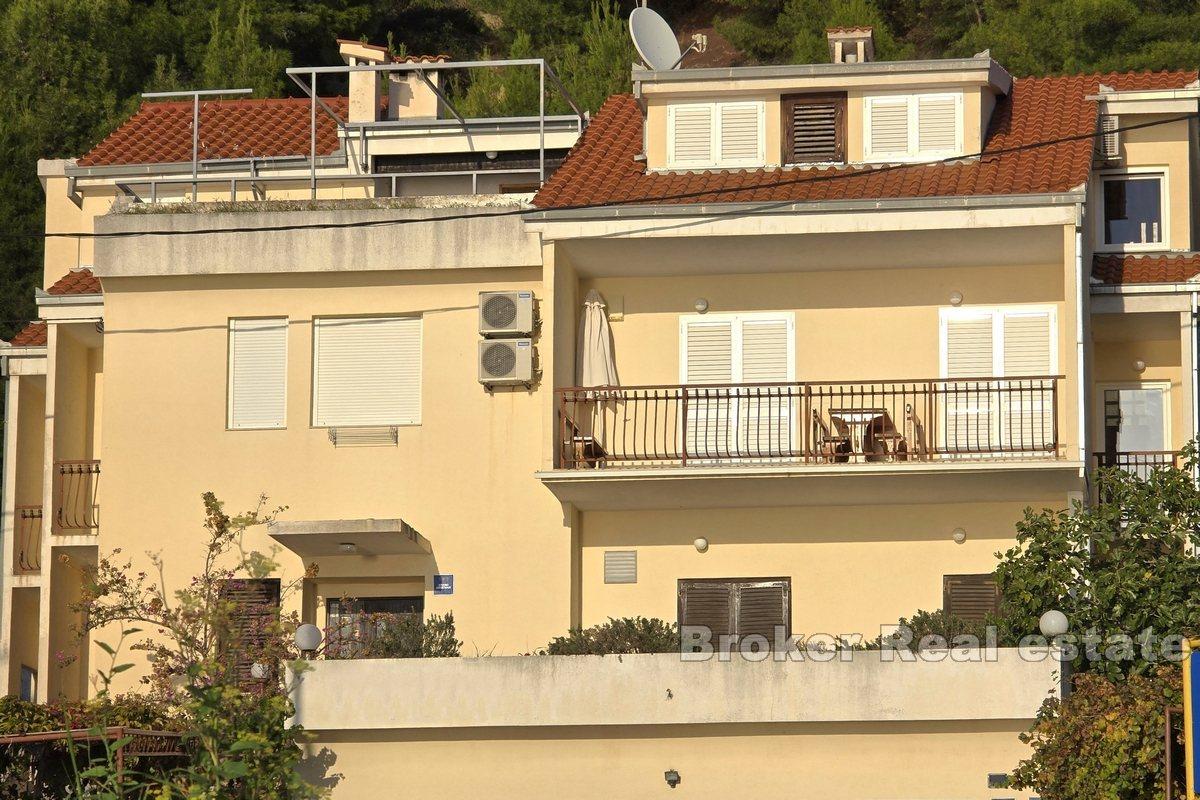 Apartment house with office space, first row to the sea