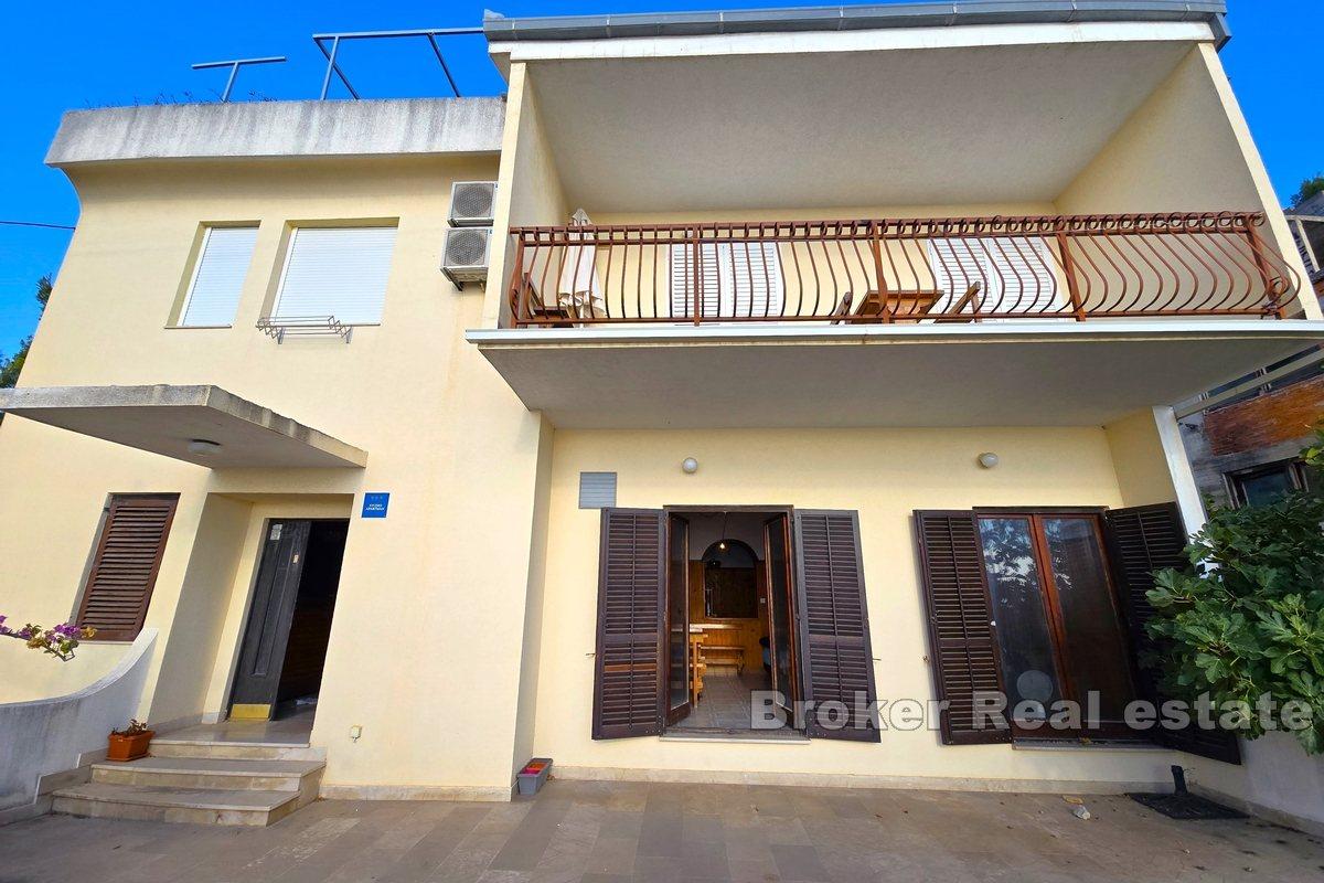 Apartment house with office space, first row to the sea