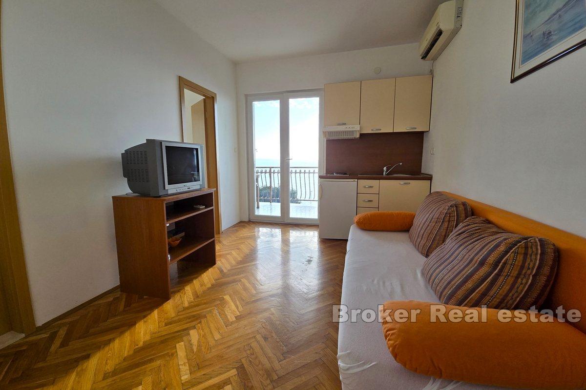 Apartment house with office space, first row to the sea