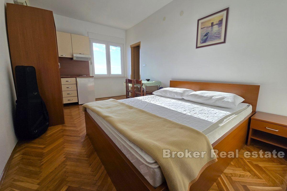 Apartment house with office space, first row to the sea