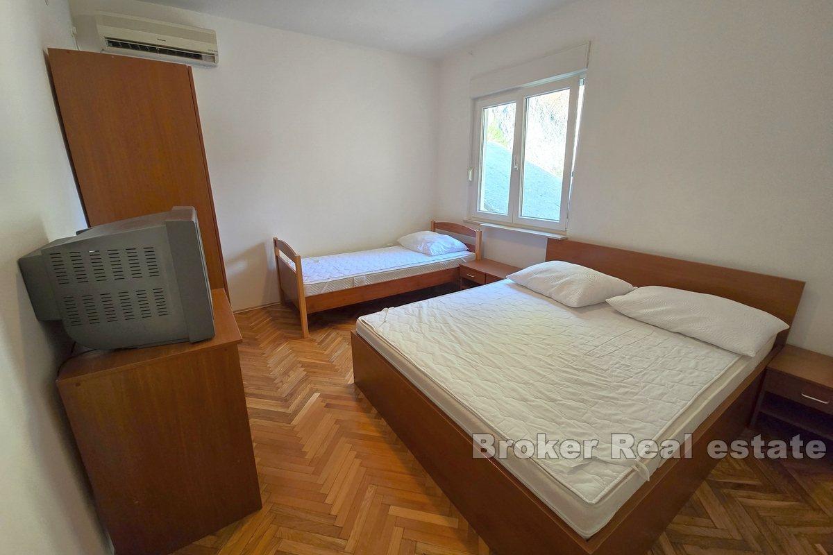 Apartment house with office space, first row to the sea