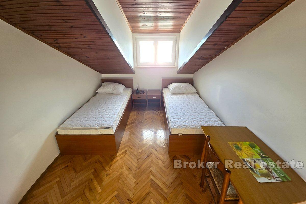 Apartment house with office space, first row to the sea