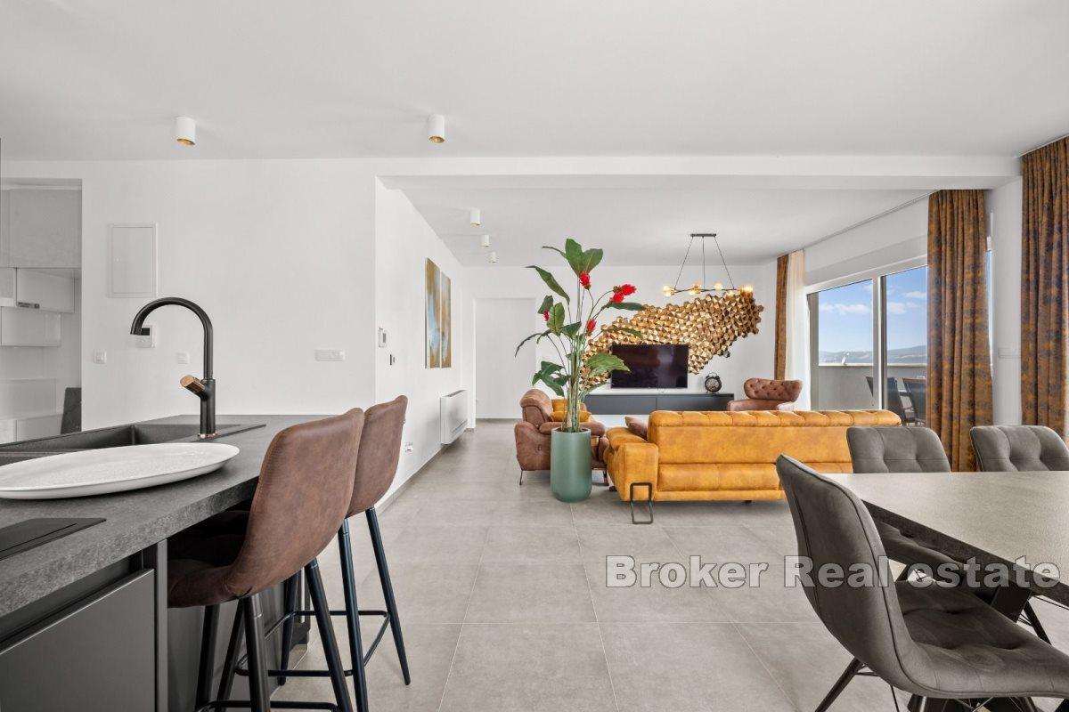 Penthouse with roof terrace and sea view