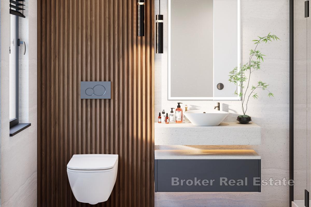 Unik toppleilighet med takterrasse i første rad mot havet