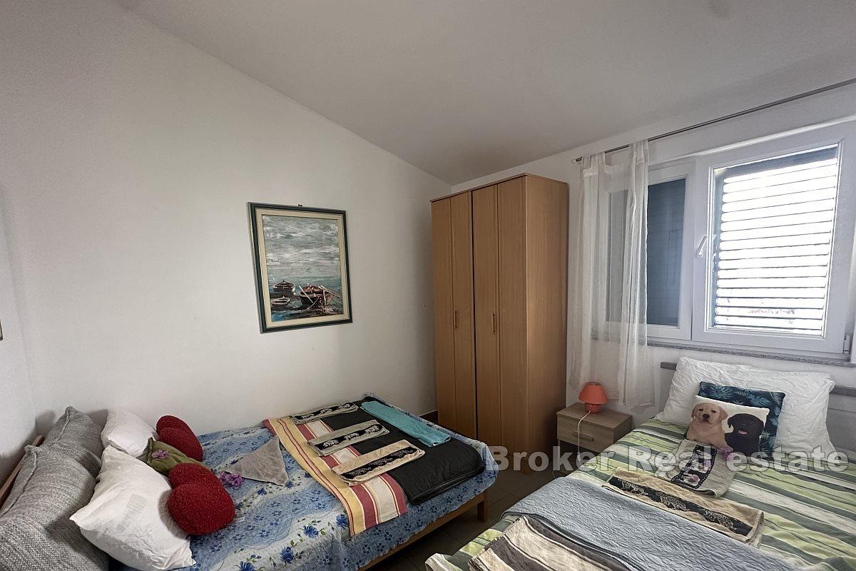 Apartment house with auxiliary facility