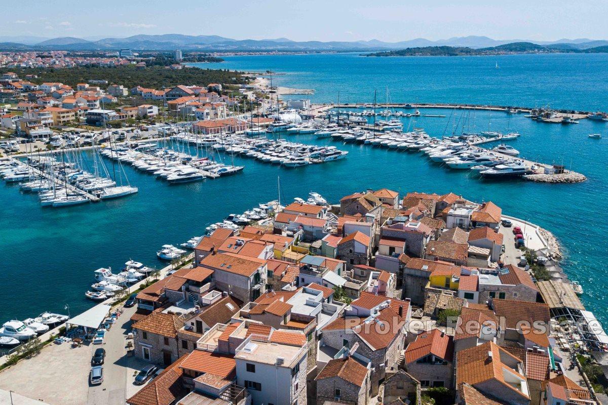 Stone house in the center of a small town with beautiful view on the bay