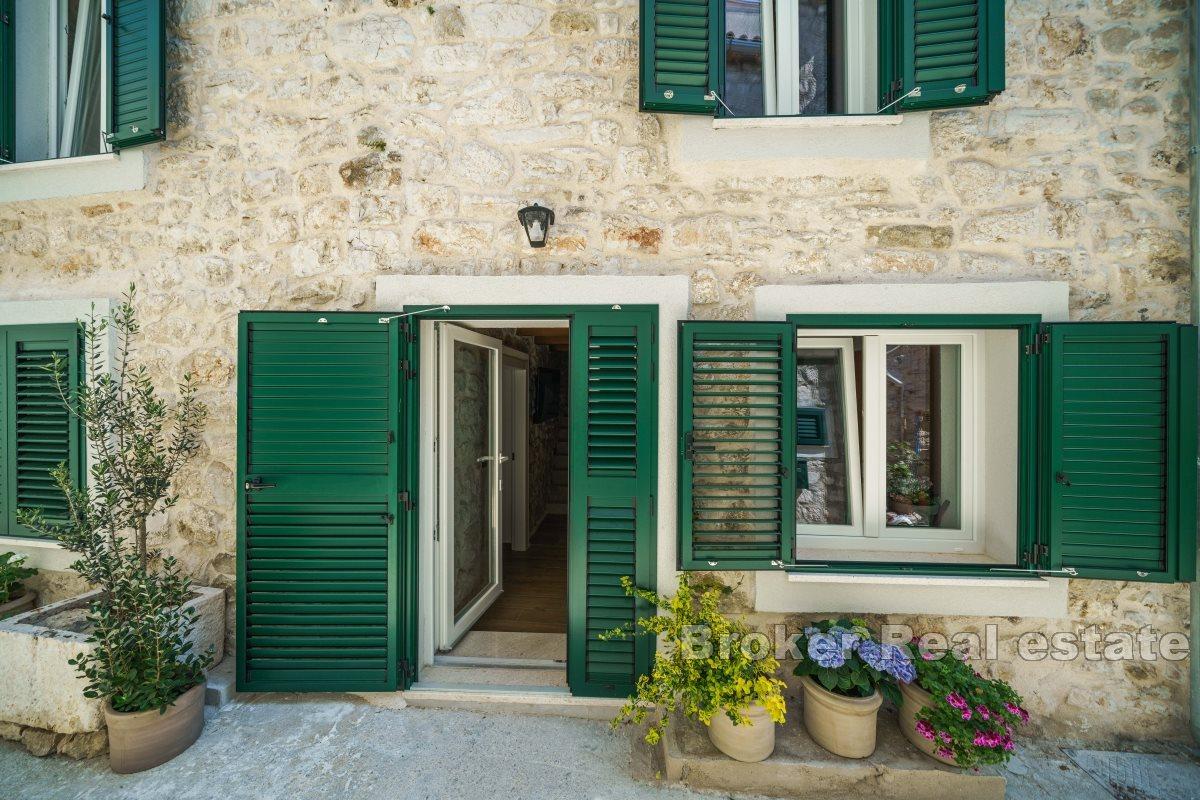 Stone house in the center of a small town with beautiful view on the bay