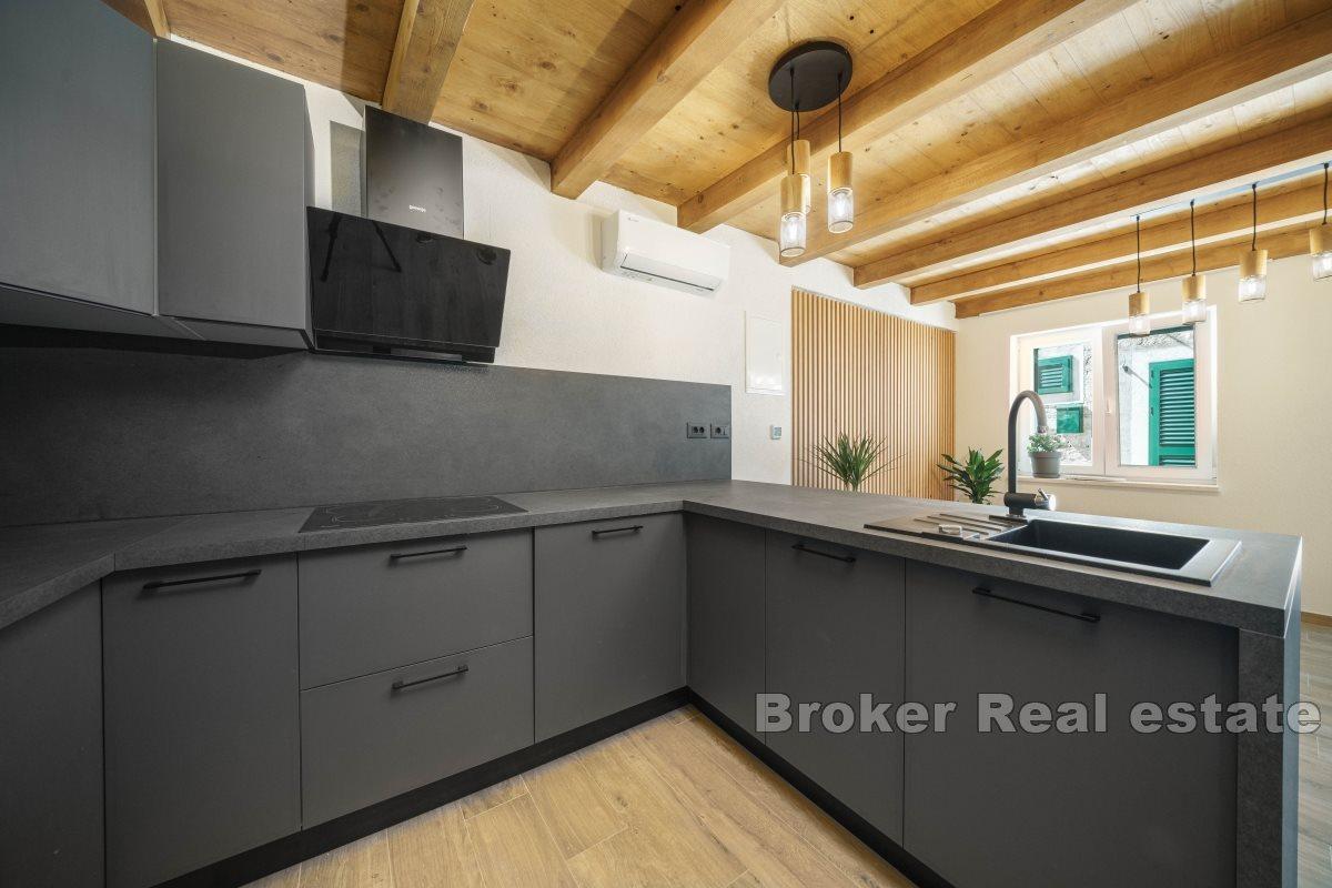 Stone house in the center of a small town with beautiful view on the bay