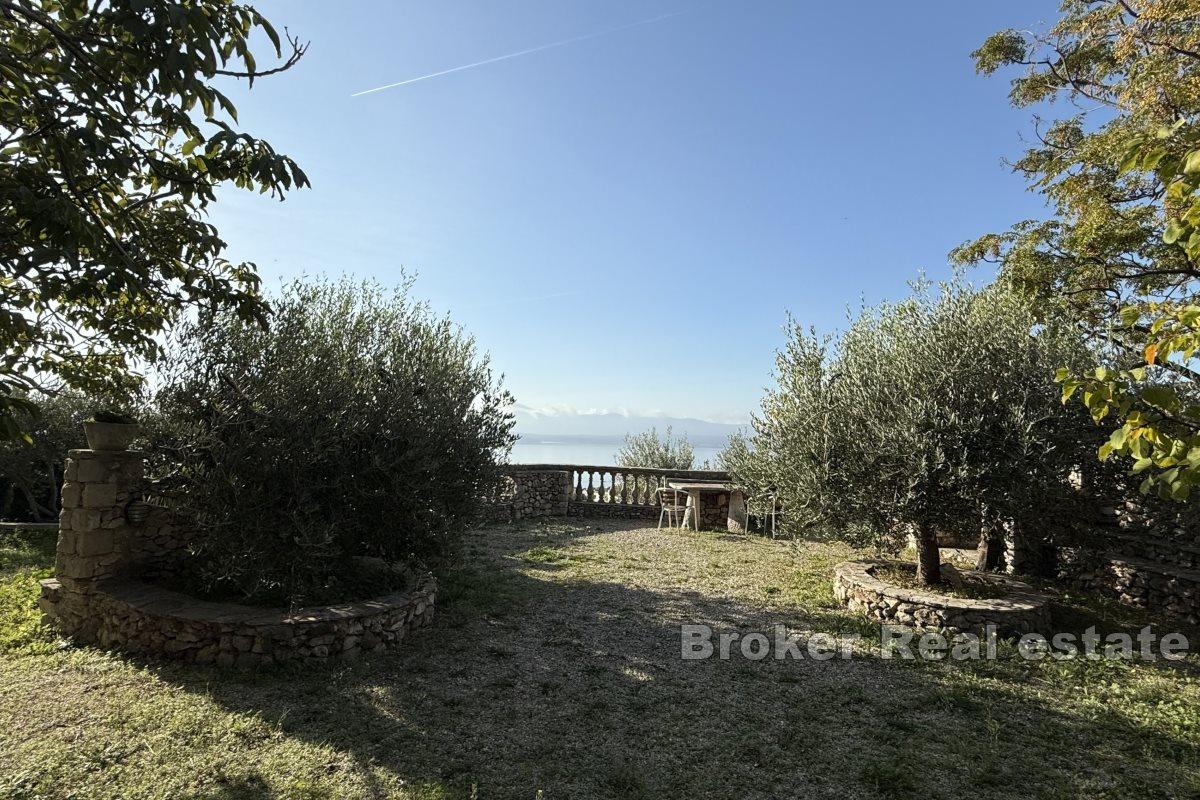 Extraordinary agricultural land with a building and a view of the sea and islands