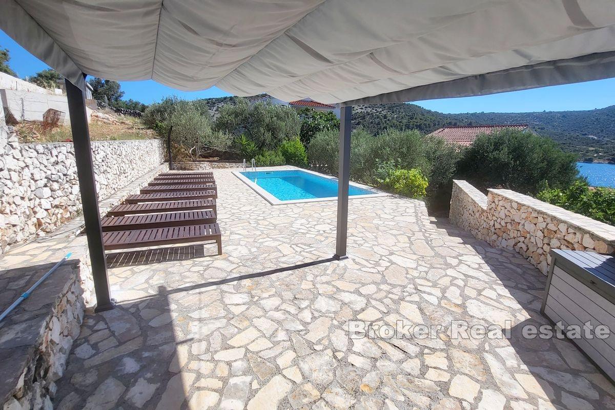 House with pool near the sea