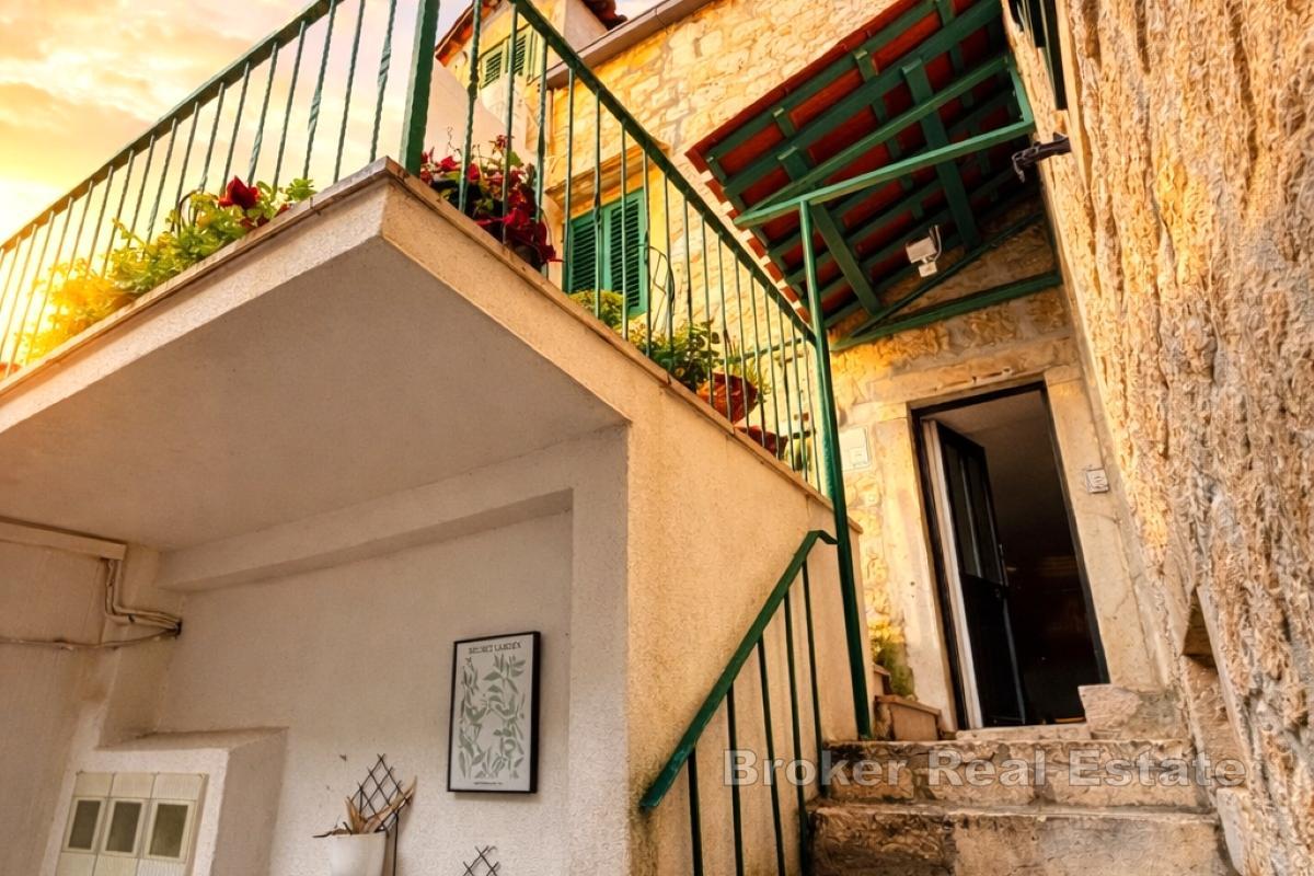 Unique stone property with 4 commercial units, family house and apartments