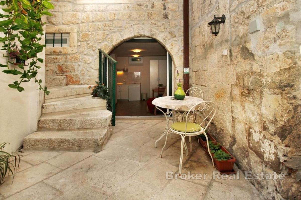 Unique stone property with 4 commercial units, family house and apartments