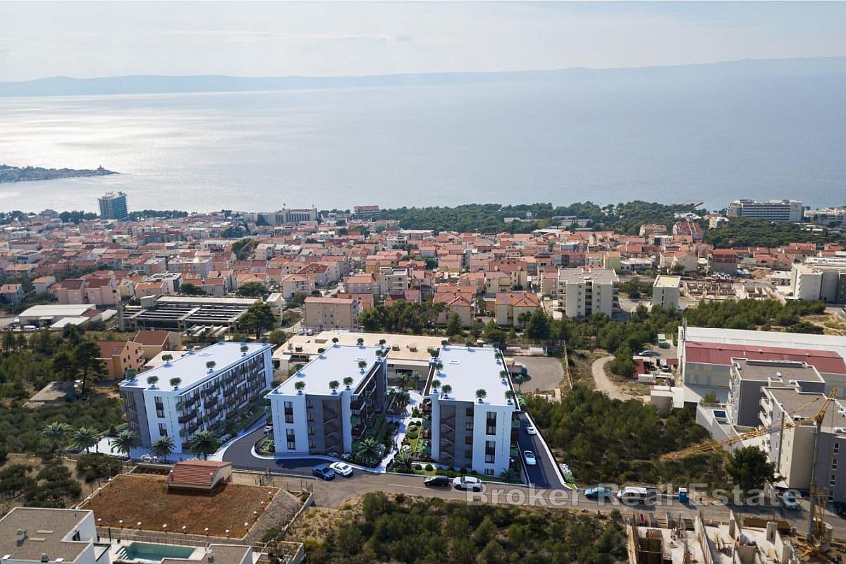 Moderno appartamento con due camere da letto in un edificio di nuova costruzione con vista parziale sul mare