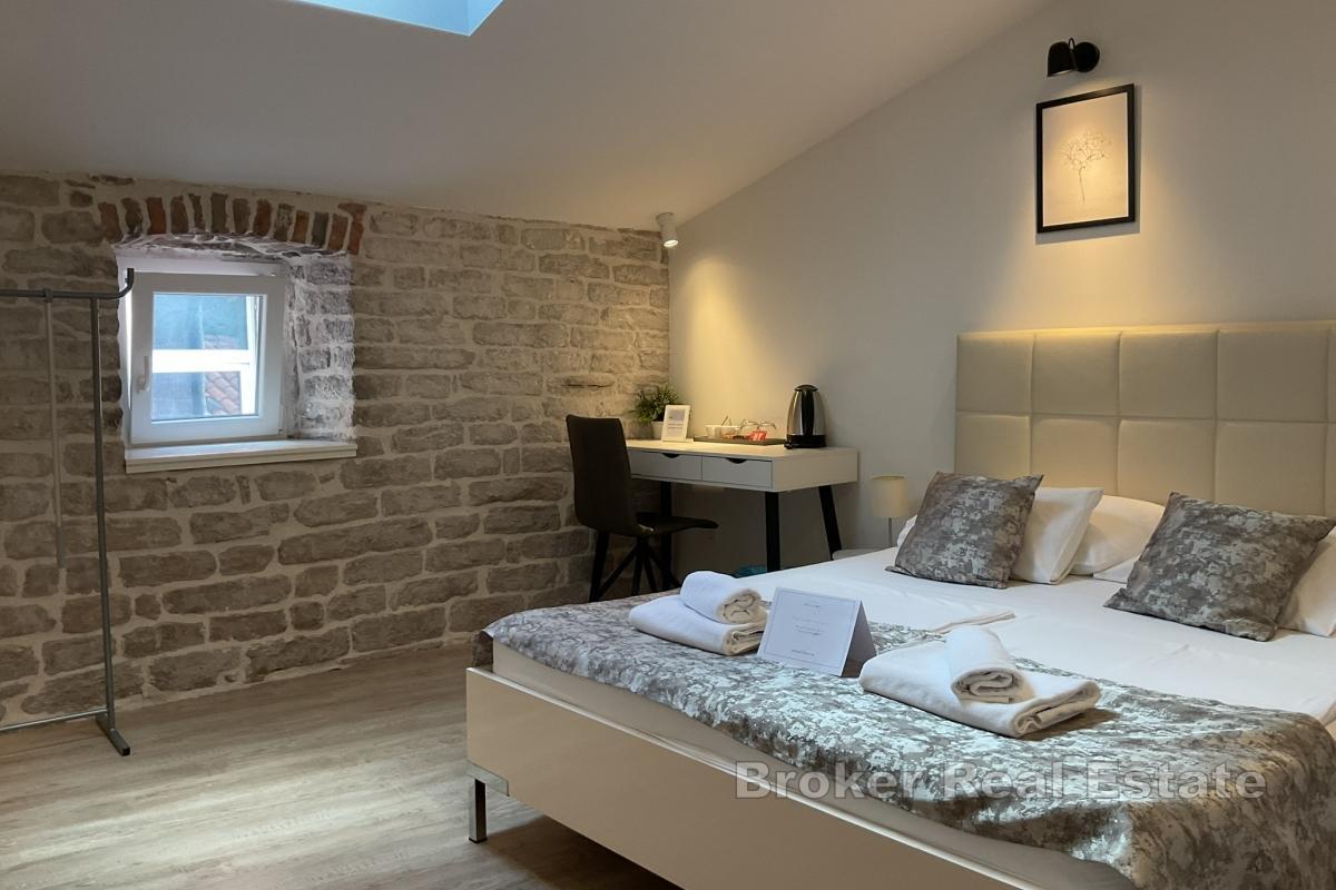 En boutiqueanläggning med 9 designerrum för den ultimata upplevelsen