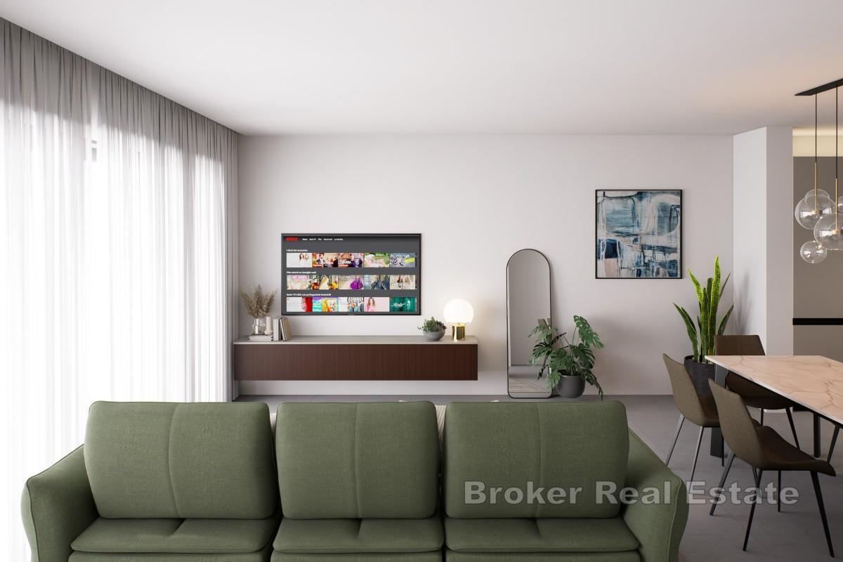 Modern lägenhet med privat trädgård