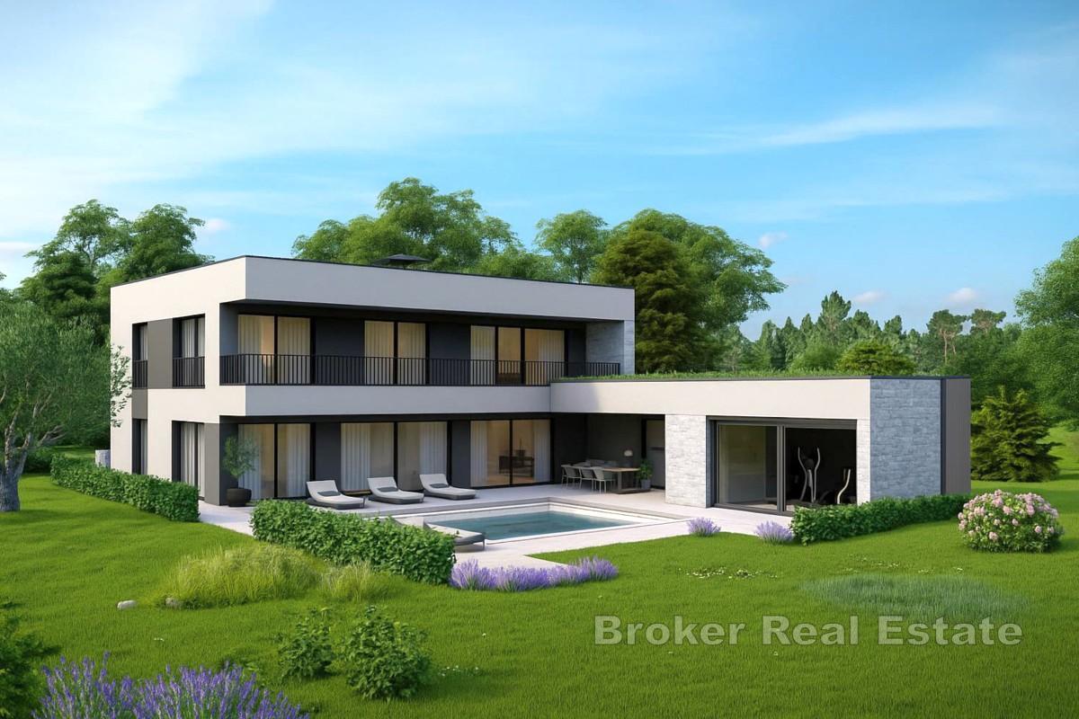 Modern villa med pool och takterrass nära havet
