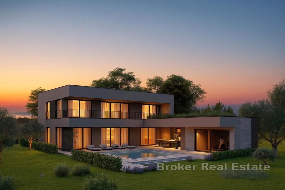 Modern villa med pool och takterrass nära havet