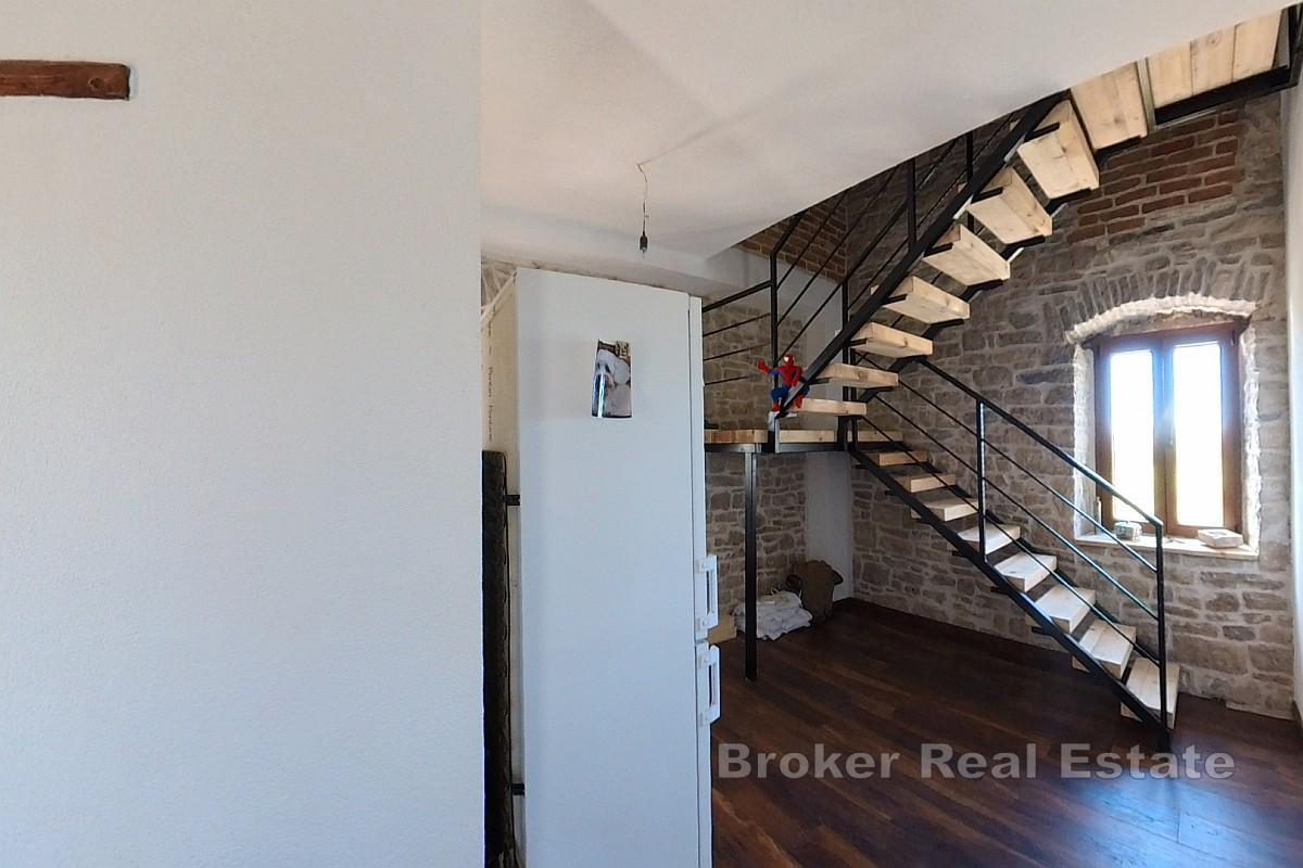 Tomannsbolig i stein